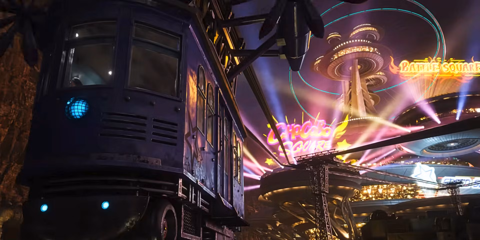 A screenshot from Final Fantasy VII Rebirth. A cablecar moves towards the Gold Saucer: a theme park that's one of Foxfire's best gaming date spots and shows off bright lights and attraction signage